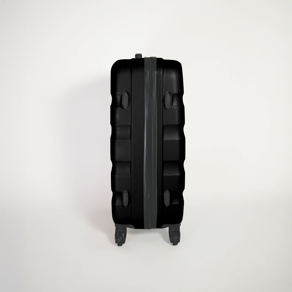 Lato destro valigia nera rigida del set trolley 4 ruote con piedini