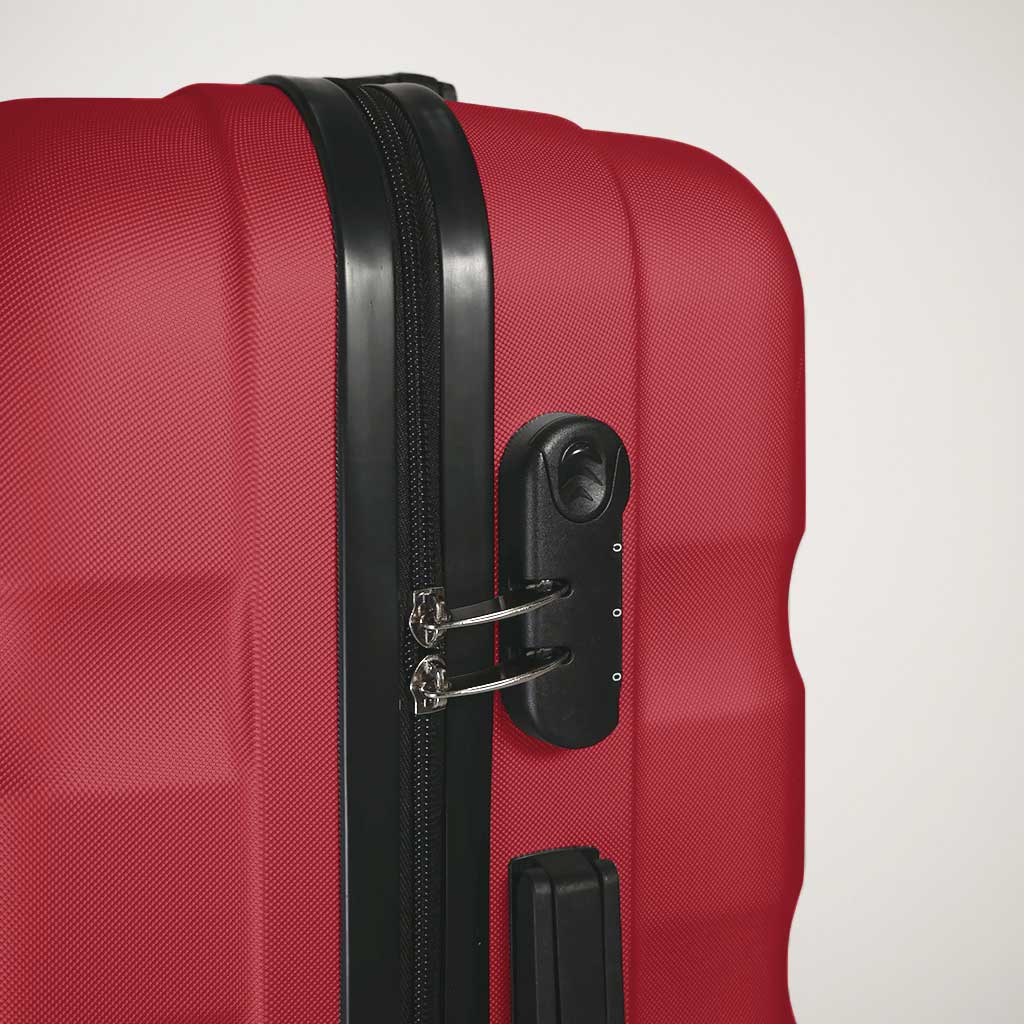 Dettaglio del lucchetto a combinazione con chiusura tramite zip valigia rossa
