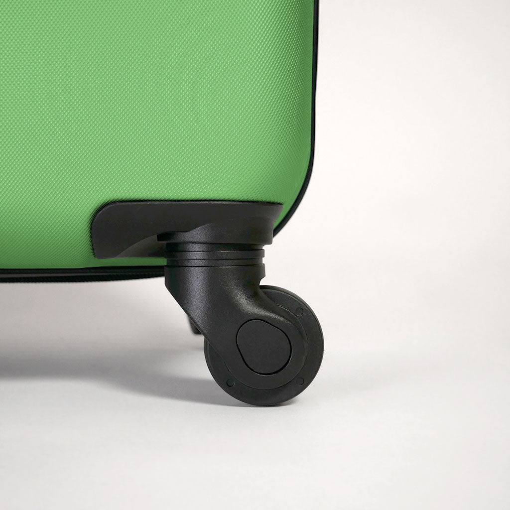 Dettaglio ruota 360 gradi valigia verde